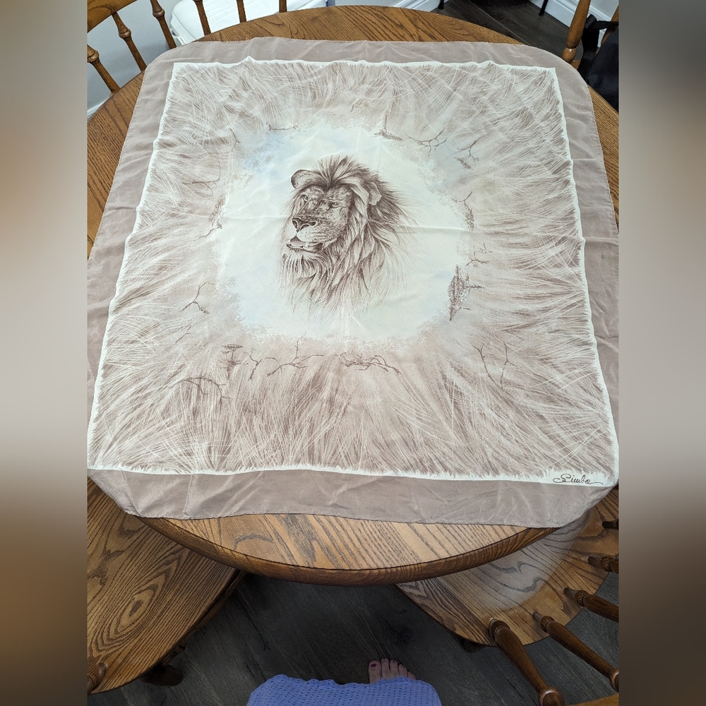 Siwbo scarf with lions head. Natural colours. Has a hand stitched rolled hem.